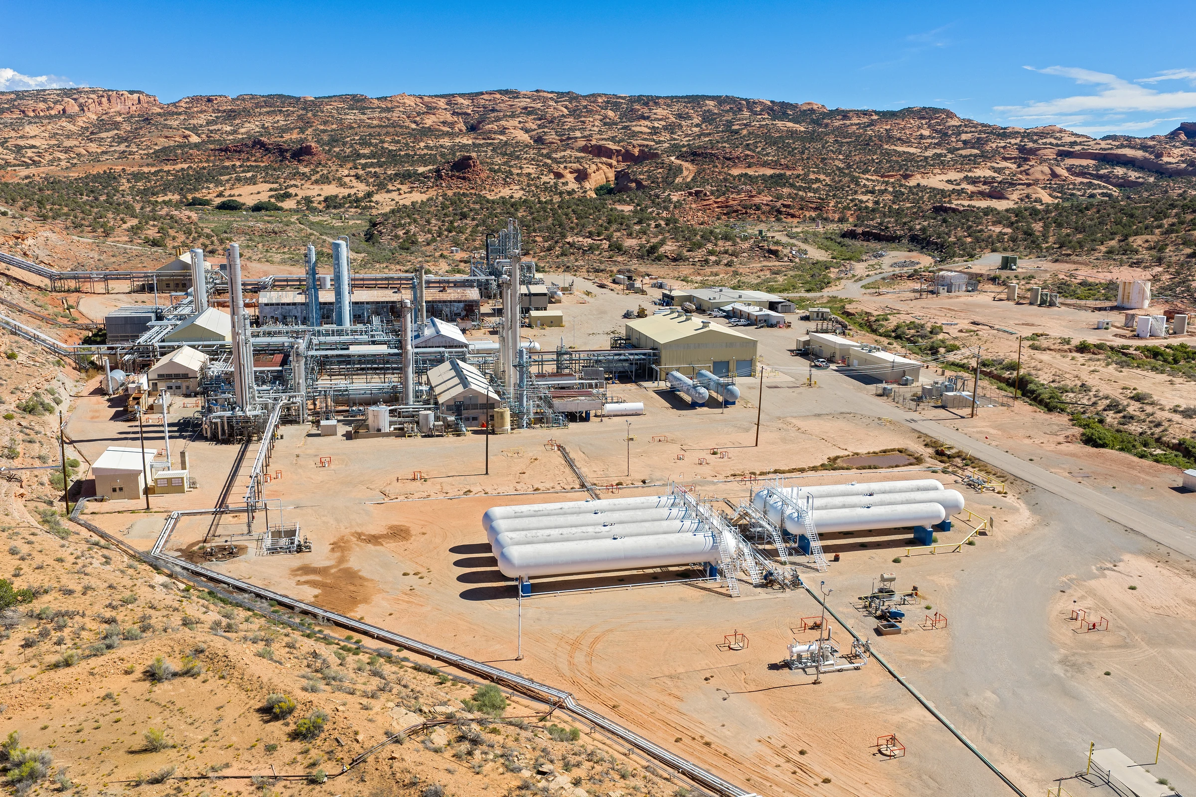 Aerial photograph of physical plant, access roads and surrounding land. Used as development context, not an installed compute facility.